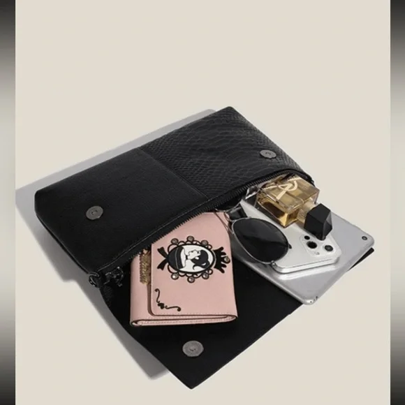 Black snakeskin print vegan leather clutchcrossbody bag